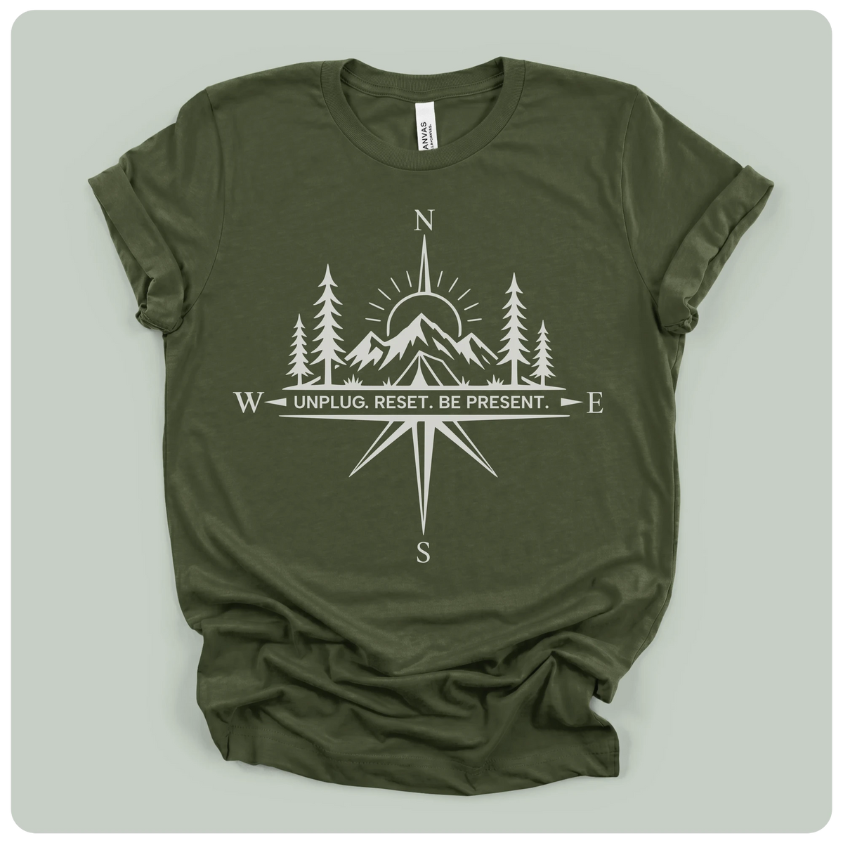 Green t-shirt with a raccoon graphic and text on a light gray background